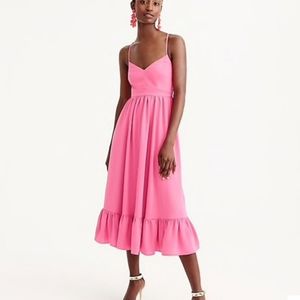 JCrew pink dress with open back and adjustable straps.  Full ruffle hem and line